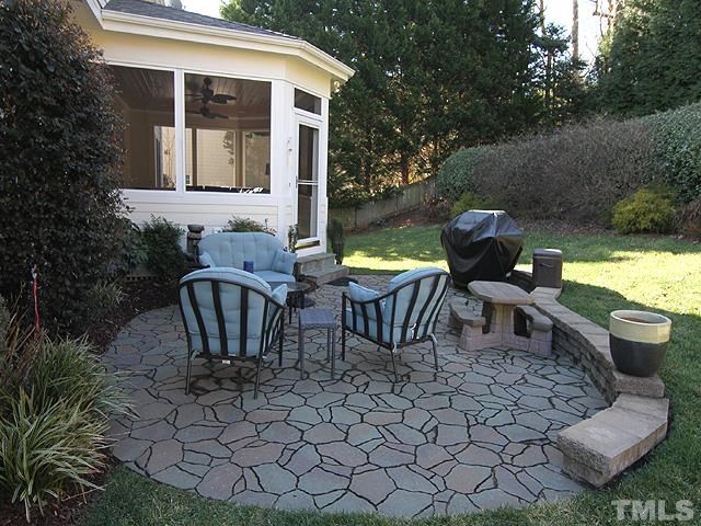 1508 Wood Spring Court Raleigh, NC 27614 - Photo 23 of 25 a view of a chairs and table in backyard of the house