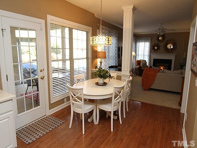 1508 Wood Spring Court Raleigh, NC 27614 - Photo 8 of 25 a view of a dining room with furniture window and wooden floor