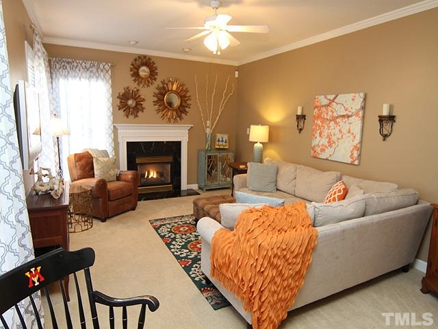 1508 Wood Spring Court Raleigh, NC 27614 - Photo 9 of 25 a living room with furniture and a fireplace