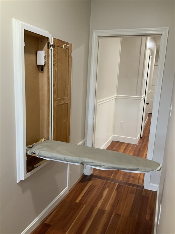 95 Broadway, Unit 2 Salem, MA 01970 - Photo 6 of 8 a view of walk in closet with wooden floor
