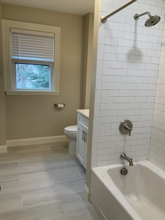 95 Broadway, Unit 2 Salem, MA 01970 - Photo 7 of 8 a bathroom with a sink and a bathtub