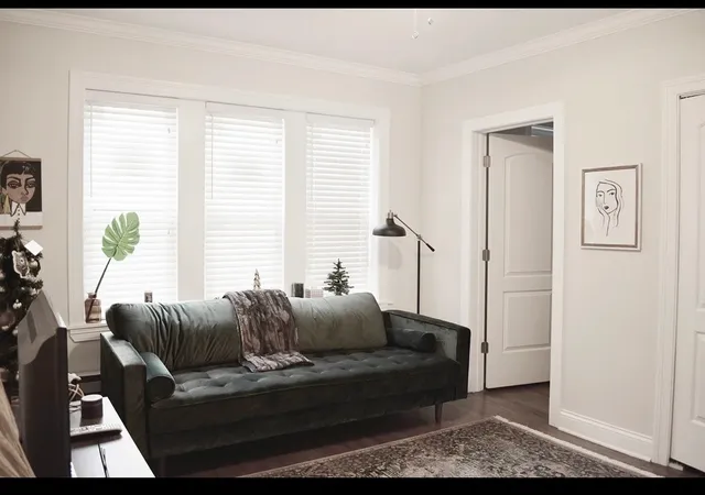 a living room with furniture and a window
