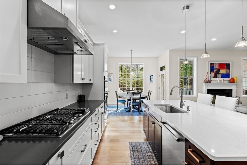 61 Ridgewood Drive Stow, MA 01775 - Photo 6 of 31 a kitchen with sink stove and cabinets