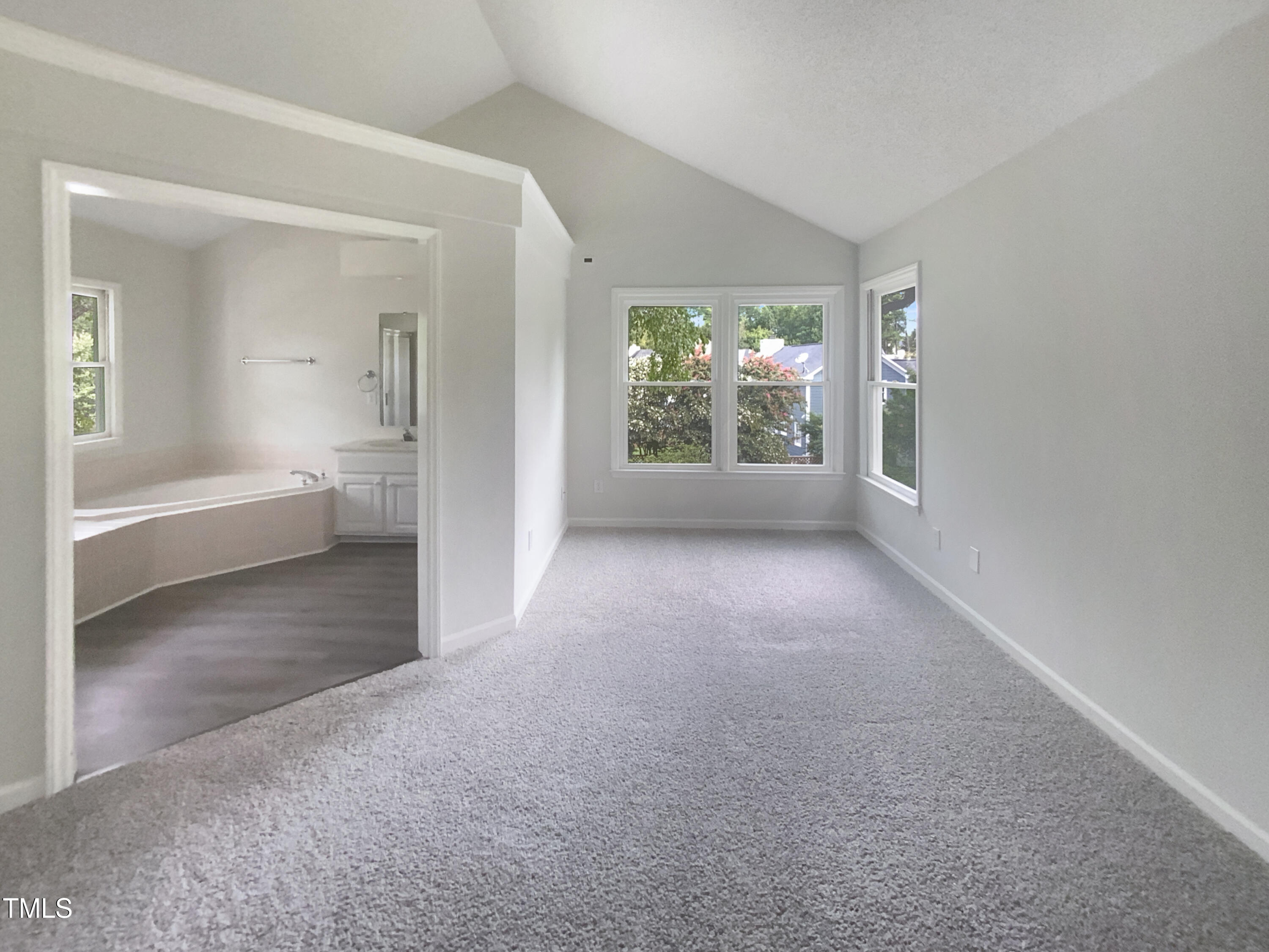 2301 Declaration Drive Raleigh, NC 27615 - Photo 14 of 19 a view of a big room with windows and chandelier
