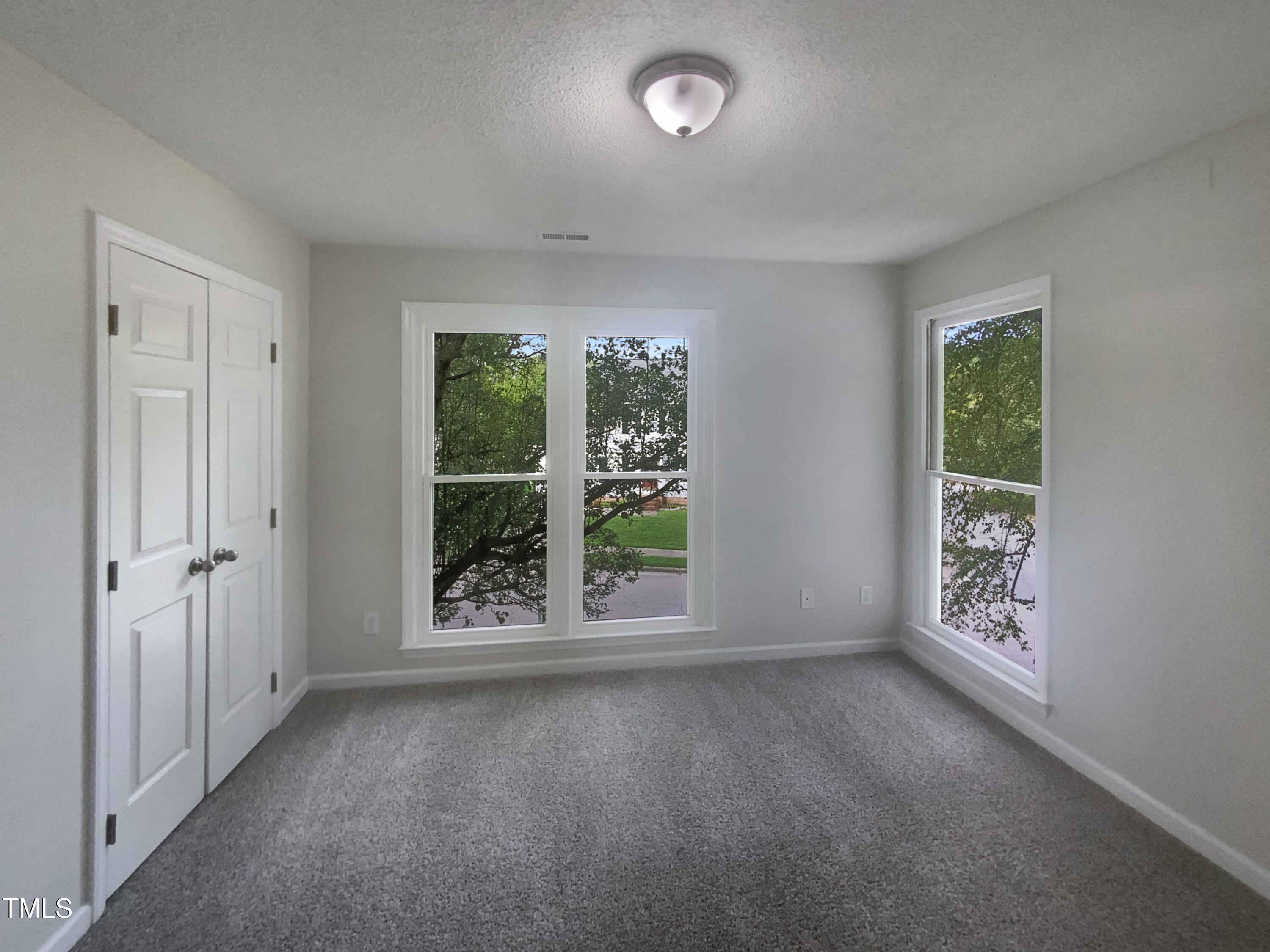 2301 Declaration Drive Raleigh, NC 27615 - Photo 15 of 19 an empty room with windows and entrance