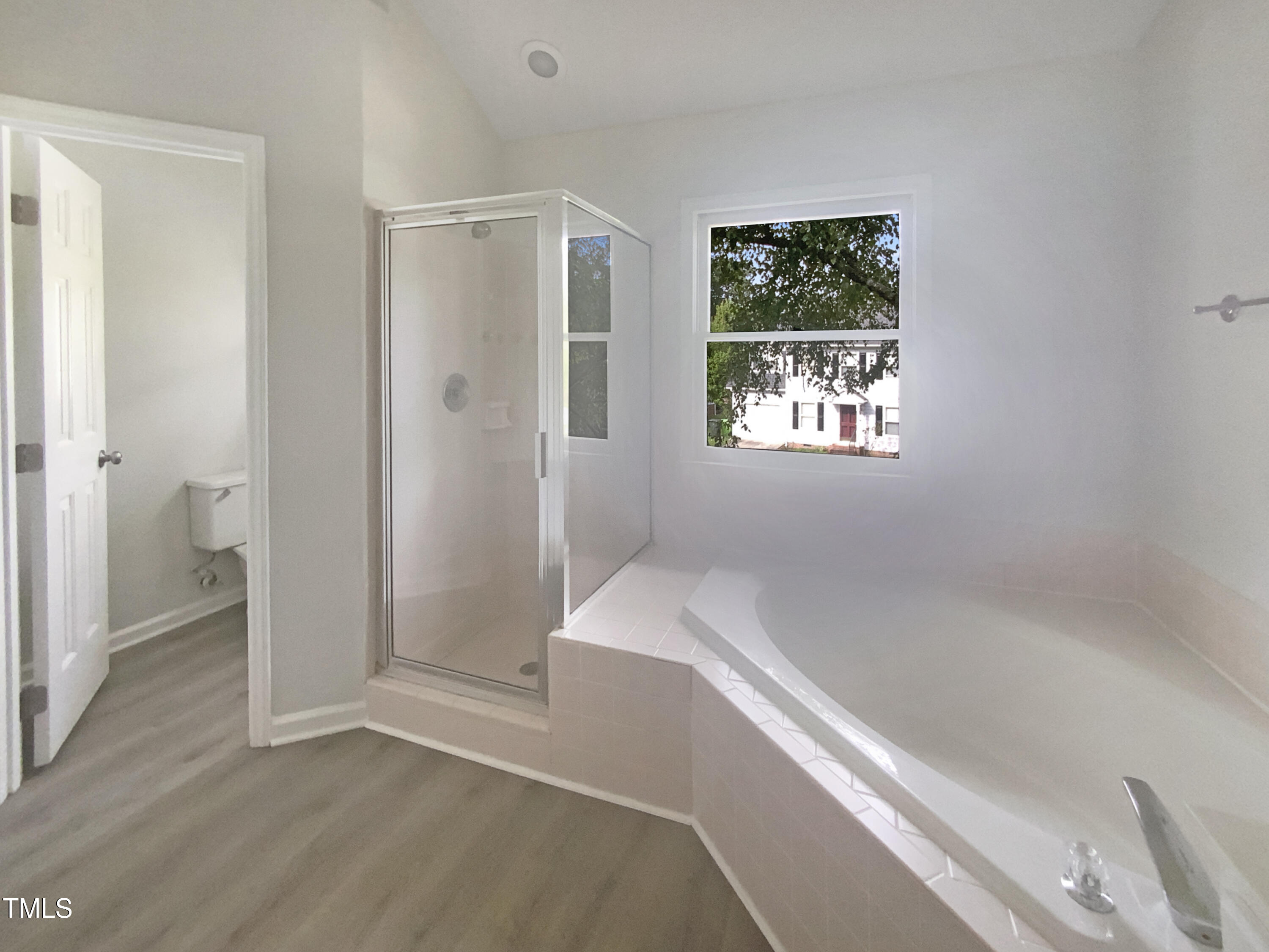 2301 Declaration Drive Raleigh, NC 27615 - Photo 18 of 19 a bathroom with a bathtub and a shower