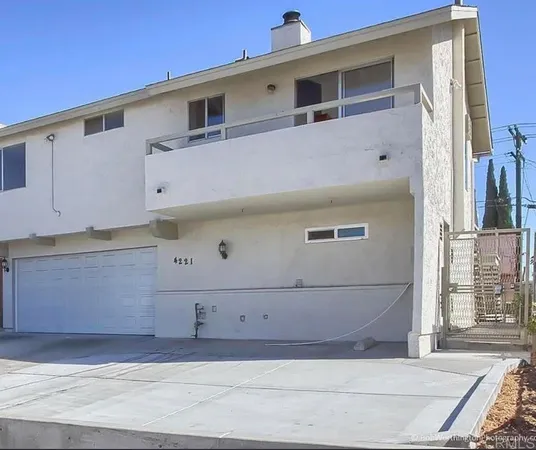 a front view of a house with a garage