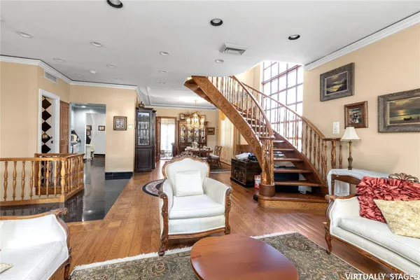 a living room with furniture and a dining table