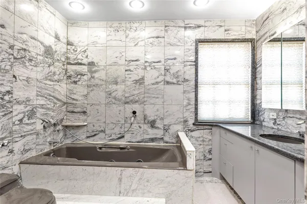 a bathroom with a sink and a bathtub