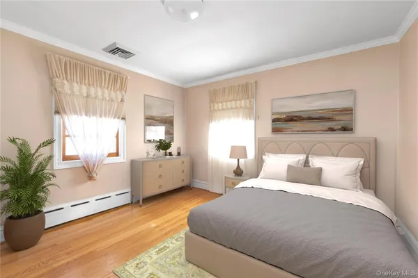 a bed room with a bed and a large window