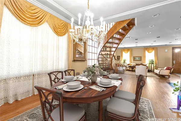 a view of a dining room with furniture window and wooden floor