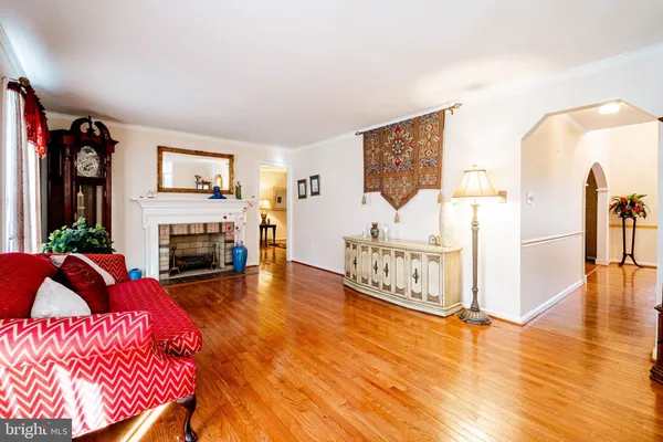 a living room with furniture fireplace and flat screen tv
