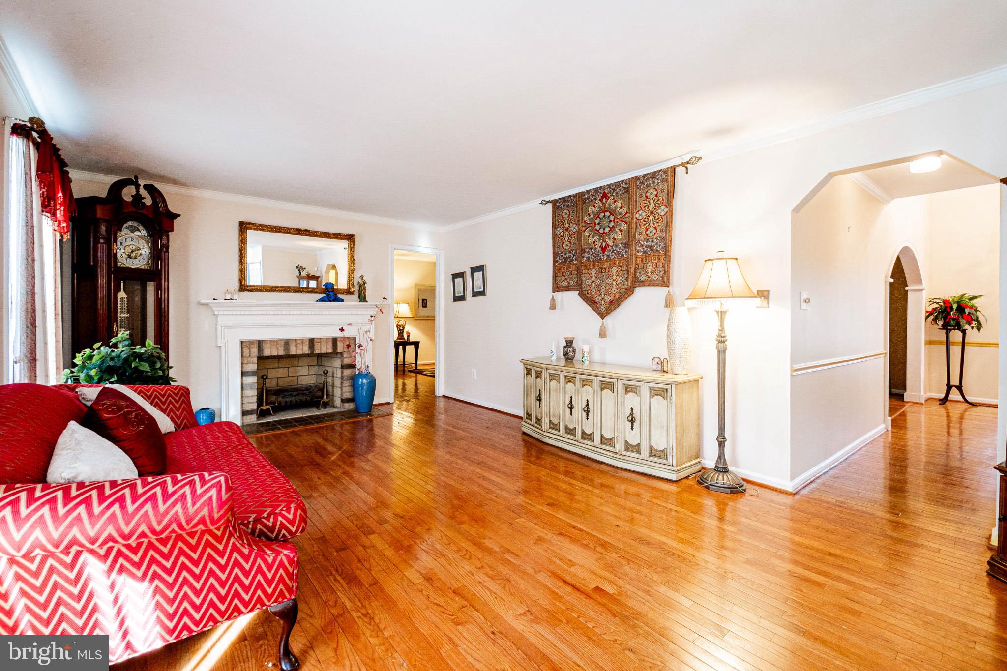 4910 Grid Street Bowie, MD 20720 - Photo 12 of 29 a living room with furniture fireplace and flat screen tv