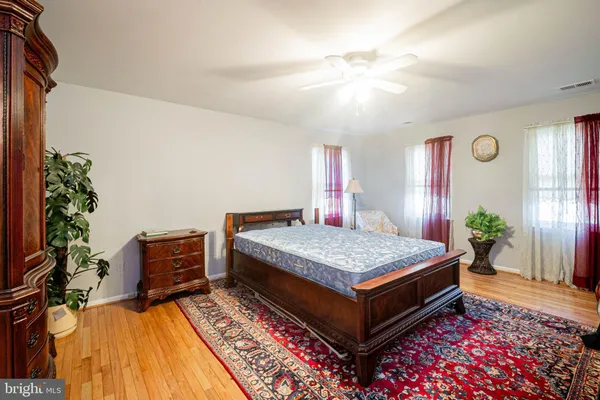 a bedroom with bed and a bookshelf