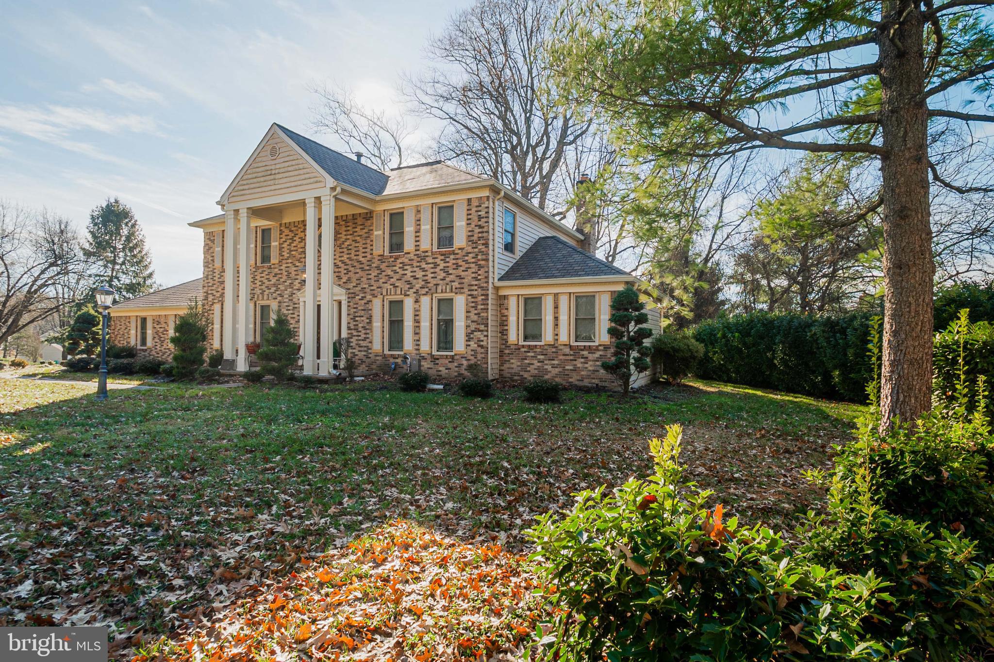4910 Grid Street Bowie, MD 20720 - Photo 2 of 29 a view of a house with yard and a garden