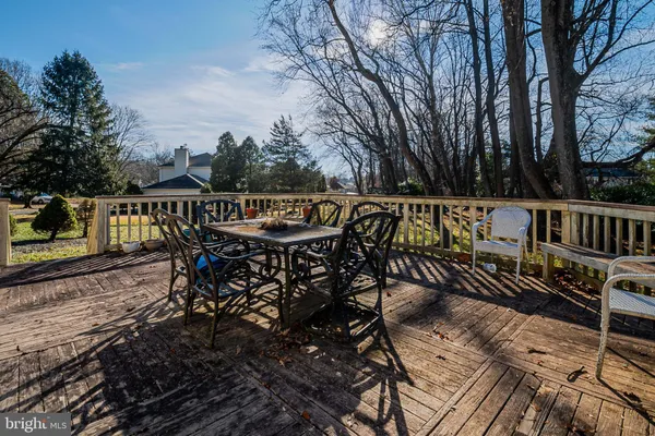 a view of a roof deck with furniture
