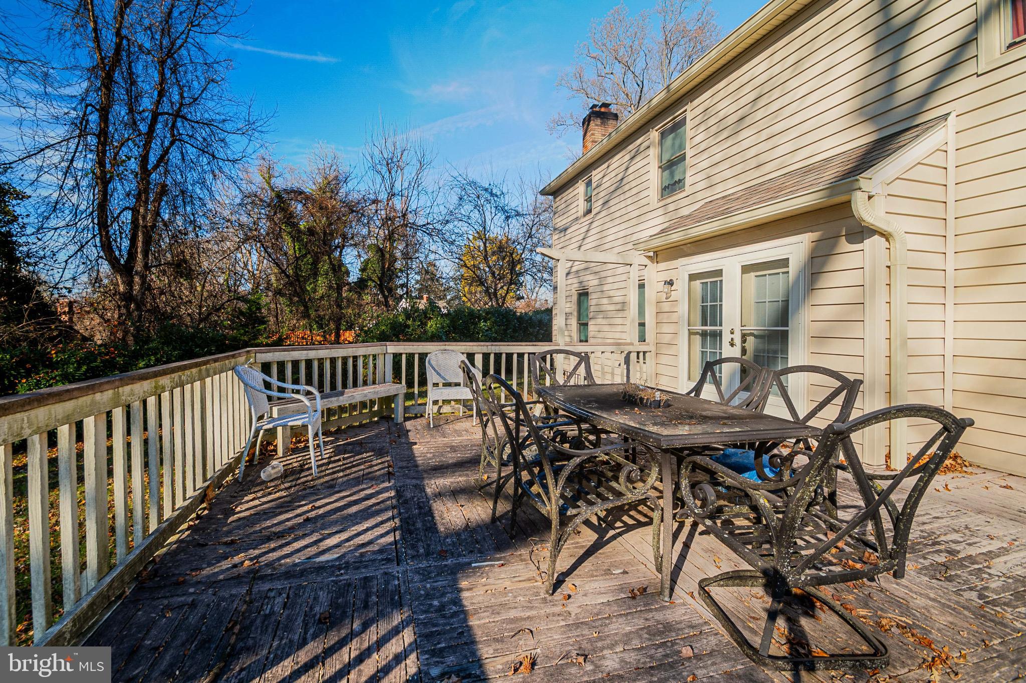 4910 Grid Street Bowie, MD 20720 - Photo 27 of 29 a view of a dinning table and chairs on the roof deck