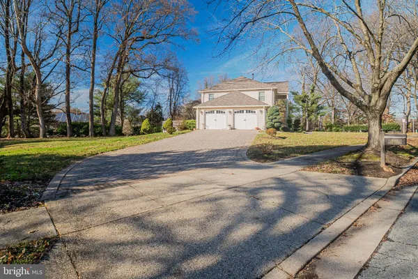 a view of a house with a yard and garage