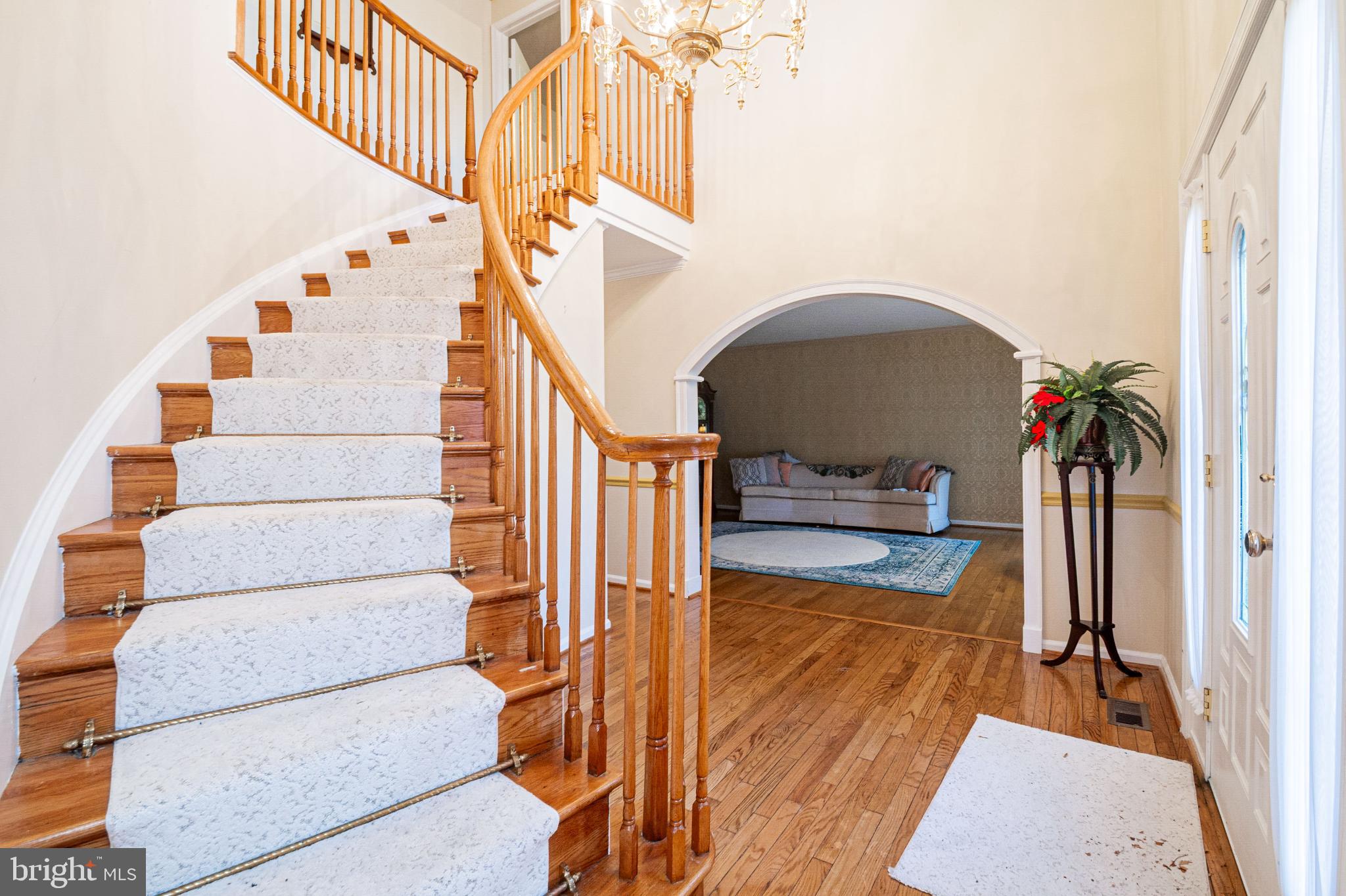 4910 Grid Street Bowie, MD 20720 - Photo 6 of 29 a view of entryway and hall with wooden floor
