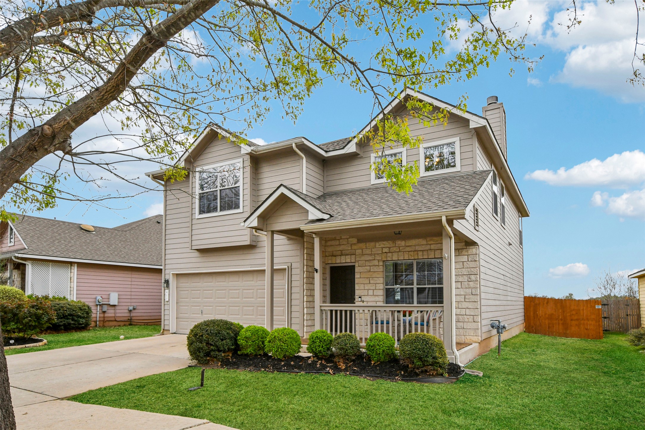 Charming Georgetown Village home with welcoming front porch and mature landscaping