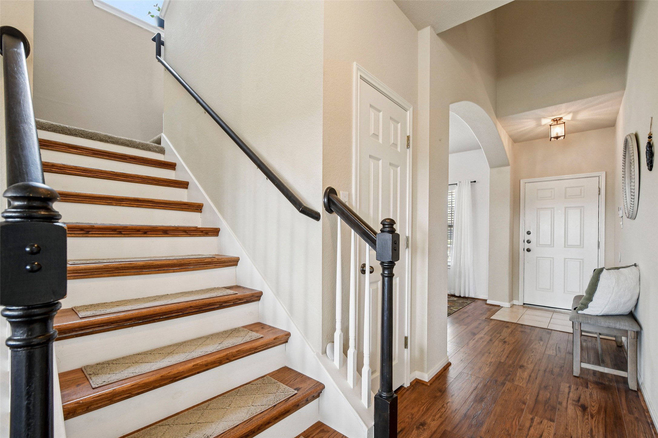 410 Rosedale Boulevard Georgetown, TX 78628 - Photo 19 of 34 Entrance foyer with dark wood-type flooring and arched walkways