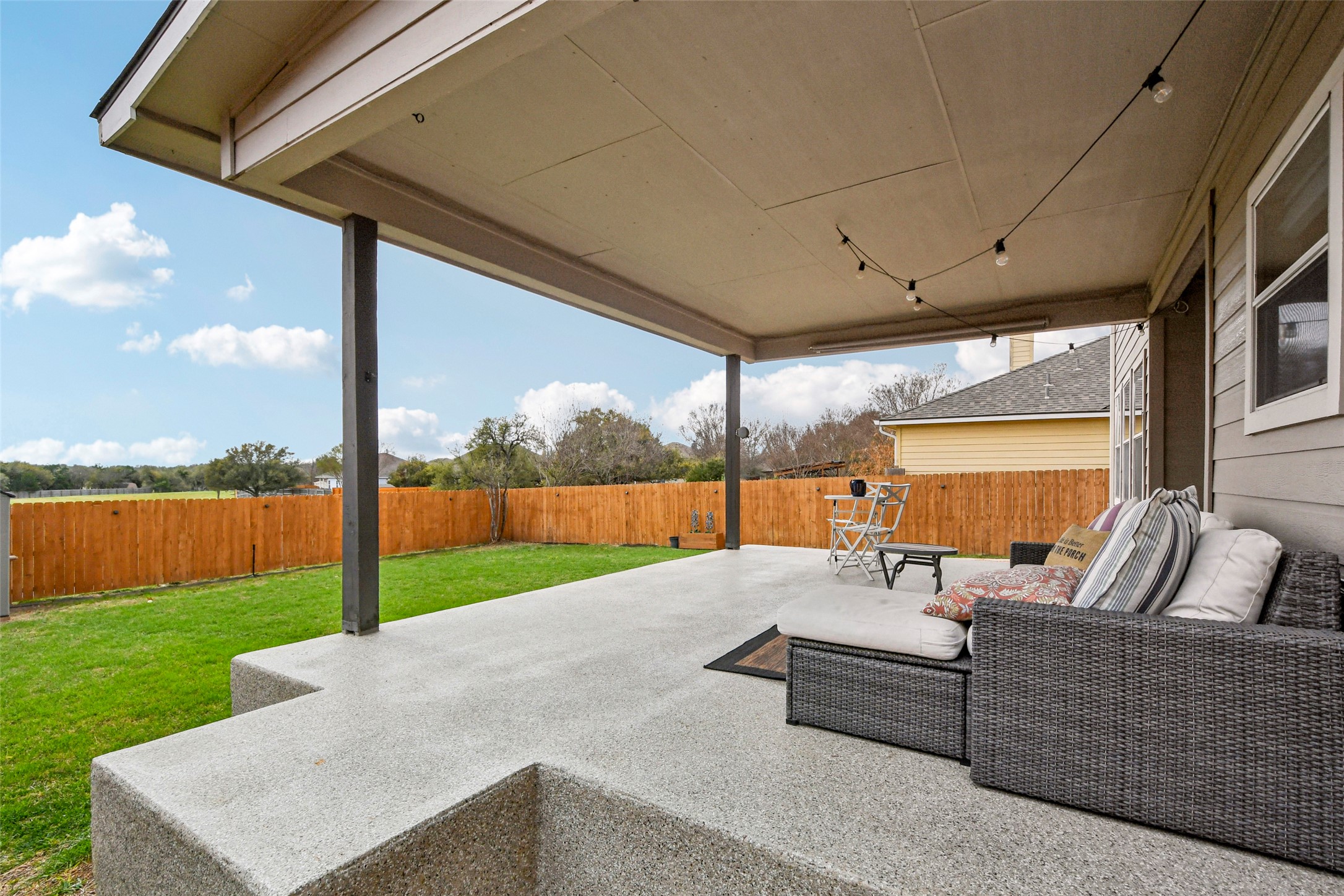 410 Rosedale Boulevard Georgetown, TX 78628 - Photo 2 of 34 Covered patio overlooking open green space behind the home; Backyard retreat with patio and peaceful open space views