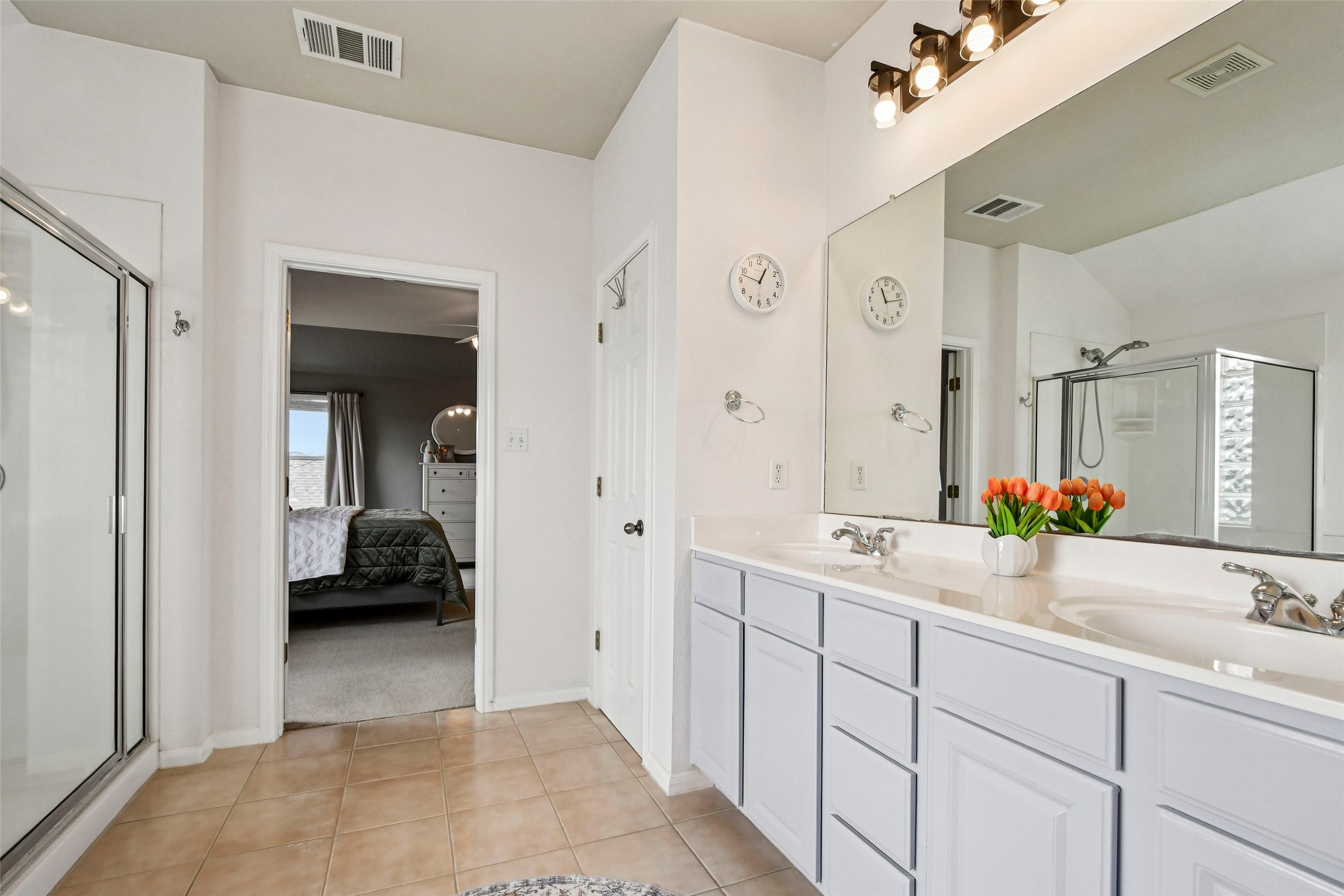 410 Rosedale Boulevard Georgetown, TX 78628 - Photo 23 of 34 Primary bath with double vanity, soaking tub, and separate shower