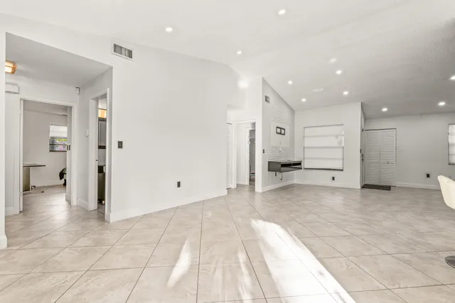 a kitchen with a sink a stove and cabinets