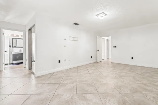 a view of a room with a wooden floor