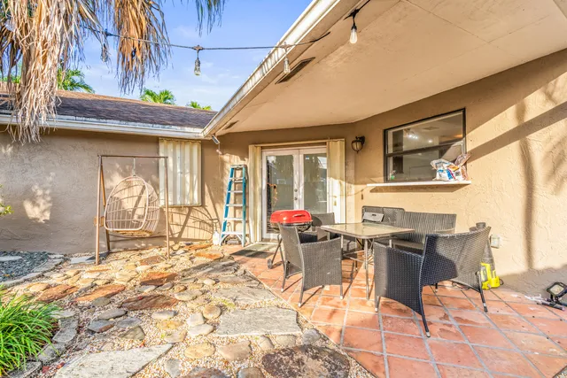 a view of road and house in the background