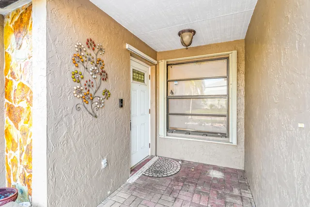 a bathroom with a window and a shower
