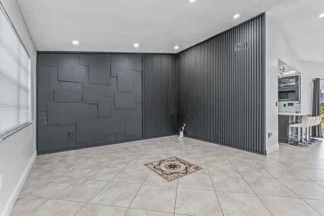 a view of a hallway with a livingroom