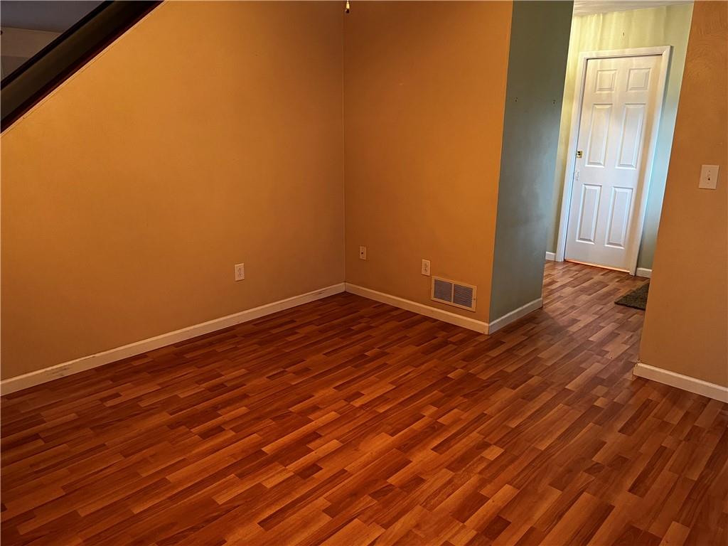 416 Ranch Road Dunbar, PA 15431 - Photo 11 of 25 a view of an empty room with wooden floor and a window