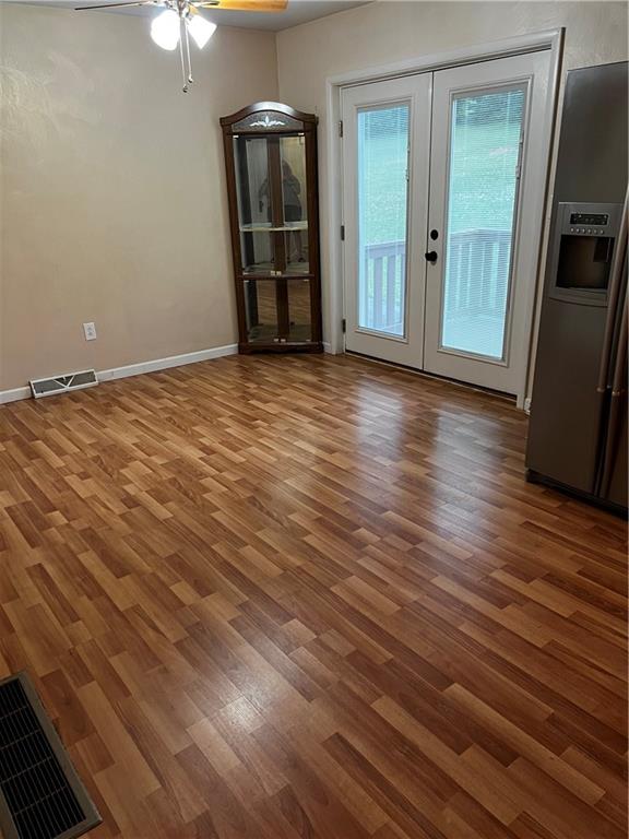 416 Ranch Road Dunbar, PA 15431 - Photo 5 of 25 an empty room with wooden floor cabinet and windows
