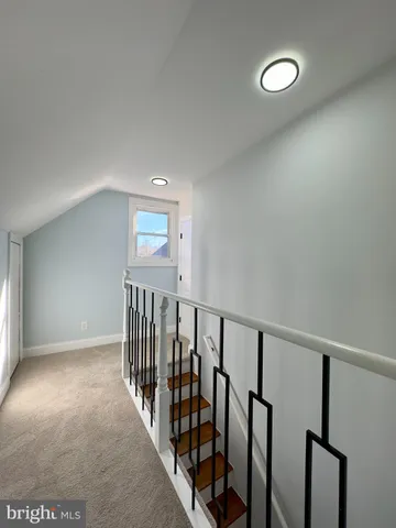 a view of hallway with stairs