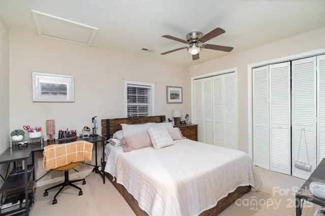 a bathroom with a sink toilet and a mirror