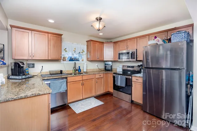 a living room with furniture and flat screen tv