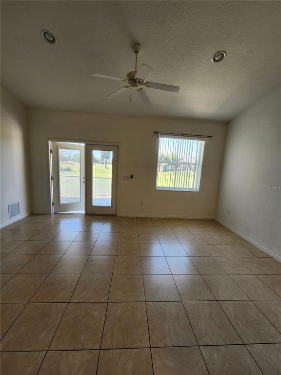 26139 Northern Cross Road Punta Gorda, FL 33983 - Photo 2 of 9 a view of an empty room with a window