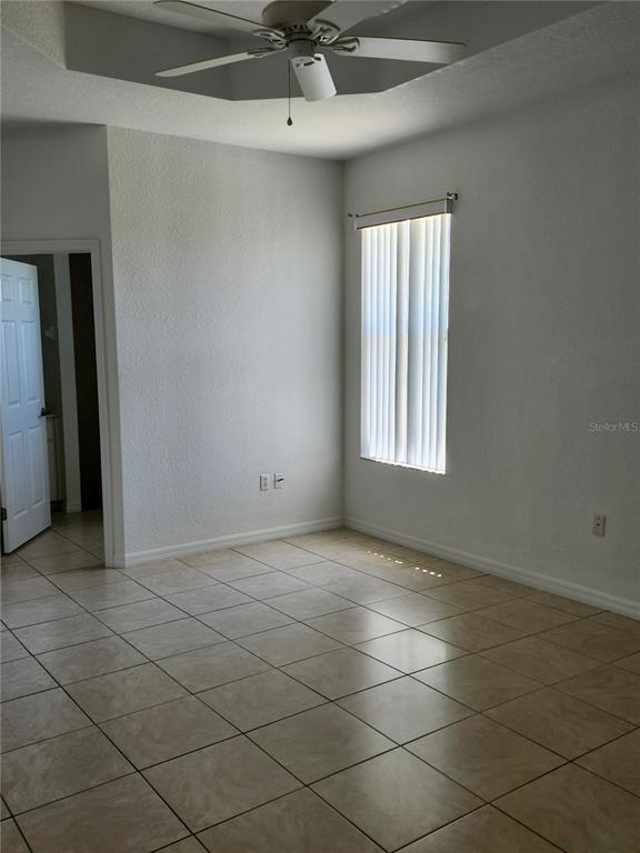 26139 Northern Cross Road Punta Gorda, FL 33983 - Photo 5 of 9 a view of an empty room and a window