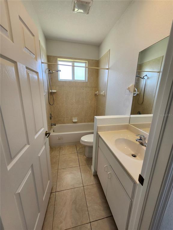 26139 Northern Cross Road Punta Gorda, FL 33983 - Photo 7 of 9 a bathroom with a sink a toilet a mirror and shower