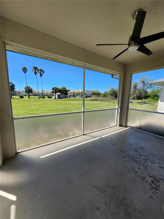 26139 Northern Cross Road Punta Gorda, FL 33983 - Photo 8 of 9 a view of an empty room with a stove and a window