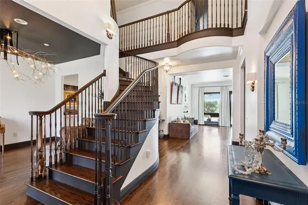a view of entryway livingroom and hall with wooden floor
