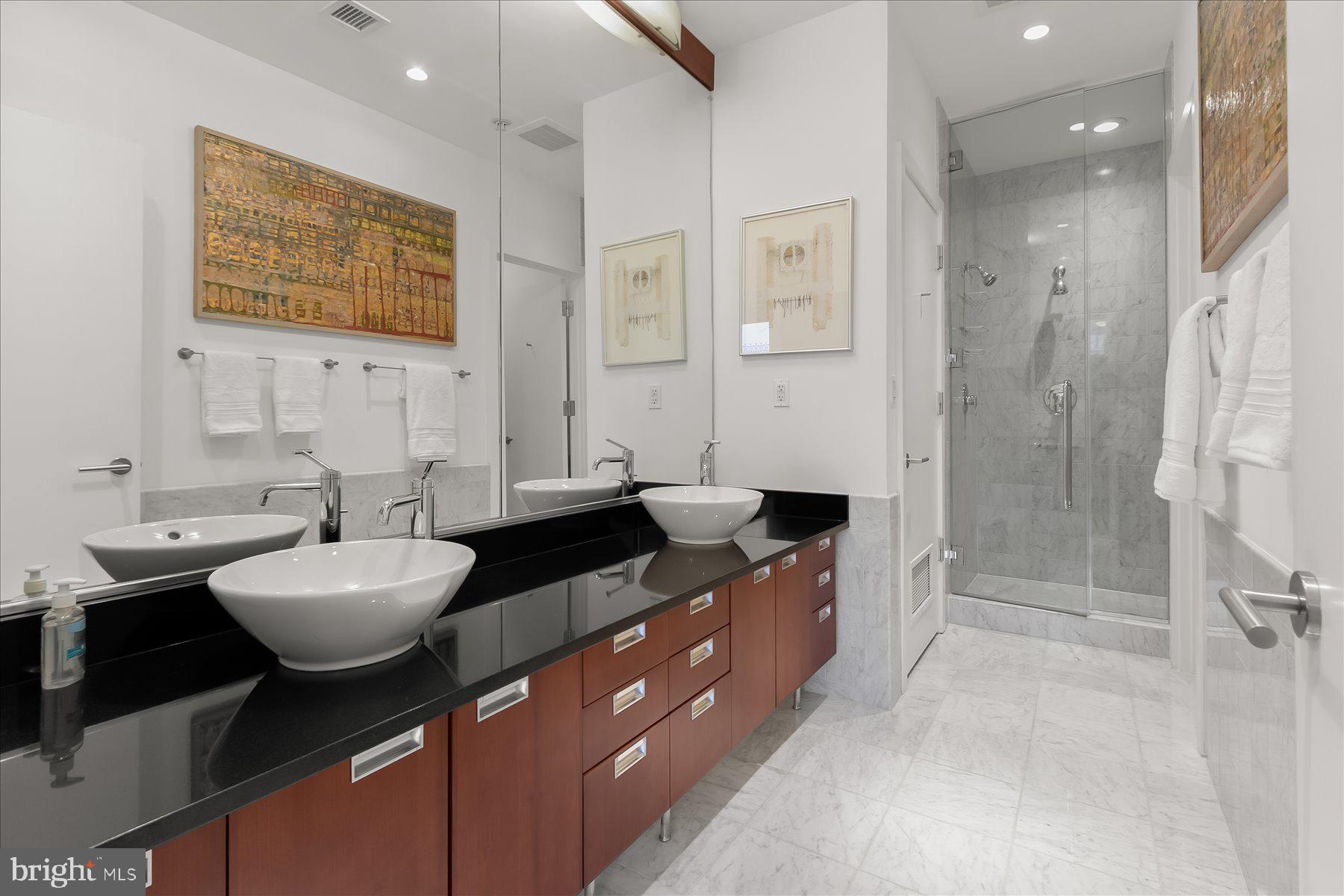 1413 P Street Northwest, Unit 301 Washington, DC 20005 - Photo 19 of 25 Spa-inspired En-suite Bath with dual vanities