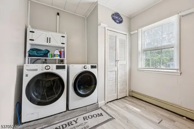 a view of a hallway with washer and dryer