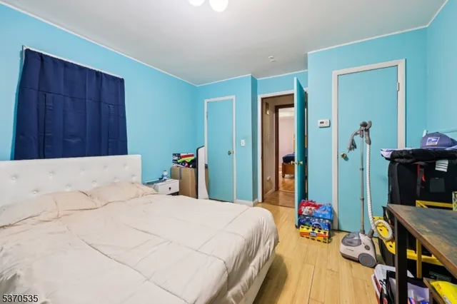 a bed room with a bed and a large mirror