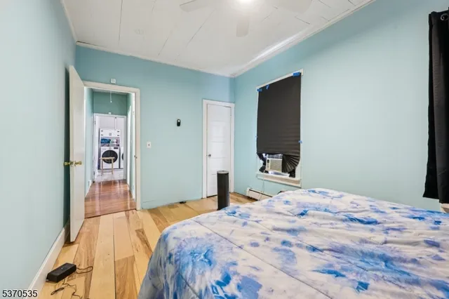 a bedroom with a bed and a mirror