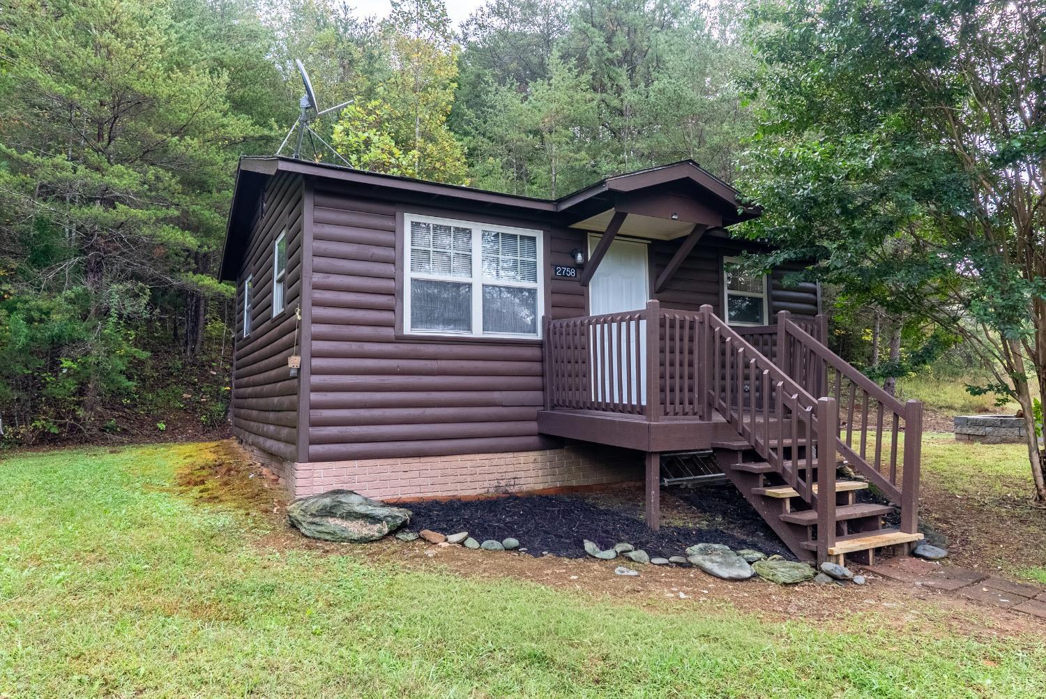2758 Allens Creek Road Gladstone, VA 24553 - Photo 17 of 25 a front view of a house with garden