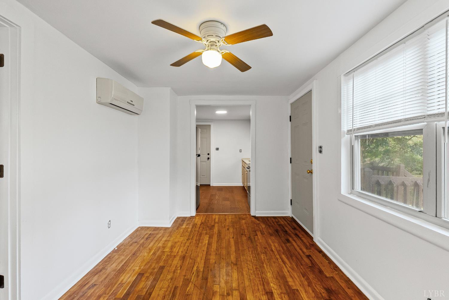 2758 Allens Creek Road Gladstone, VA 24553 - Photo 4 of 25 a view of a bedroom with wooden floor and a window