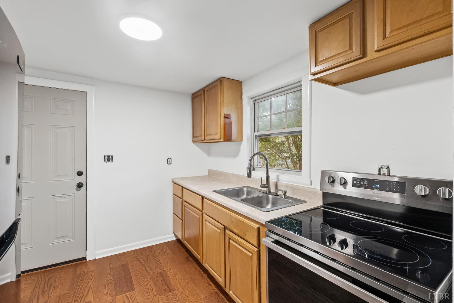 2758 Allens Creek Road Gladstone, VA 24553 - Photo 6 of 25 a kitchen that has a sink and a stove