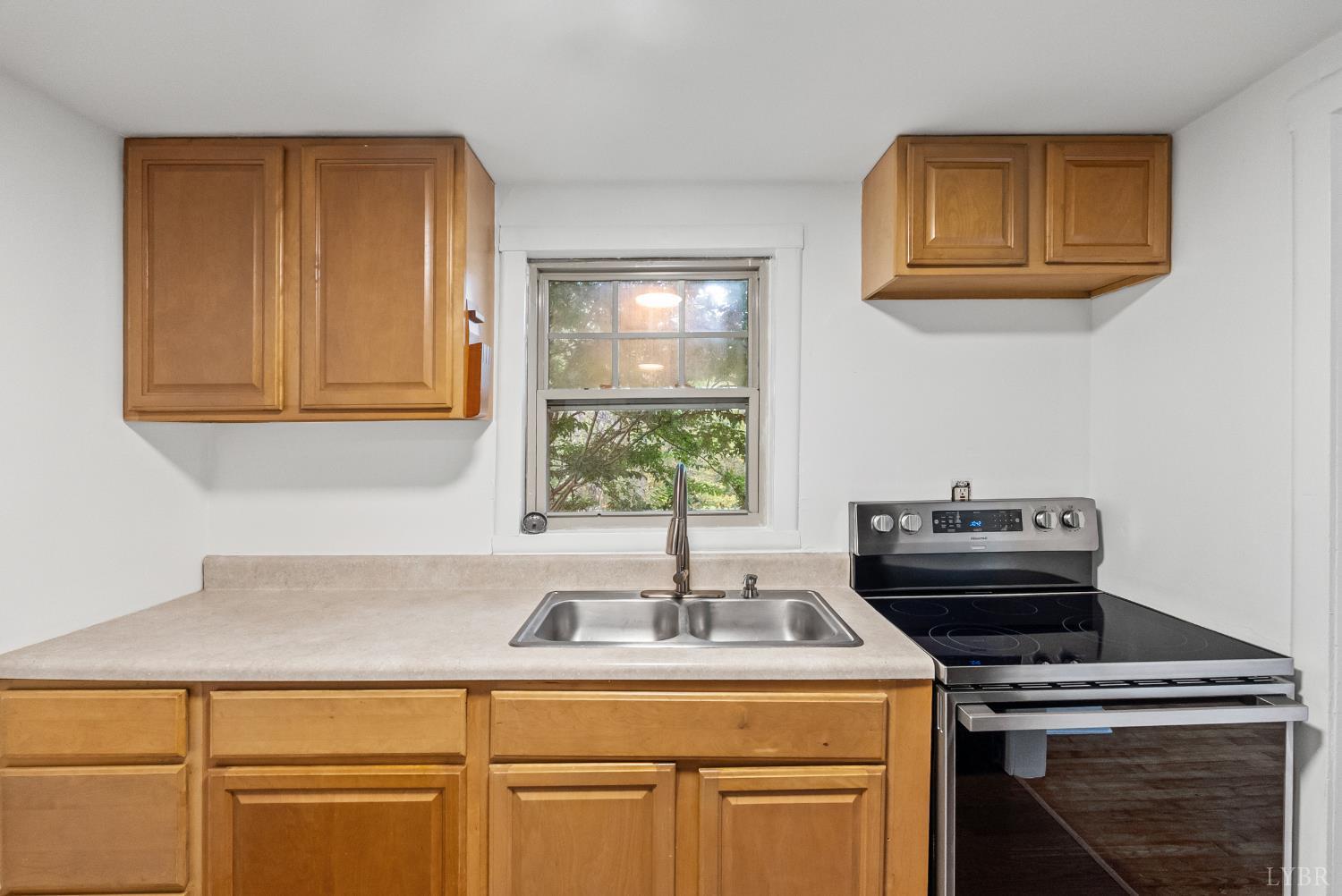 2758 Allens Creek Road Gladstone, VA 24553 - Photo 7 of 25 a kitchen with a sink cabinets and appliances